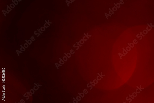 Abstract blurred gradient mesh background on dark red maroon colour. Ideal as wallpaper,banner,sale brochure, online post,graphic design, screen saver,card, etc.,