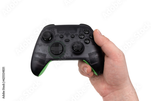 Joystick in hand on a white background. Gamepad in hand closeup isolated on white background.
