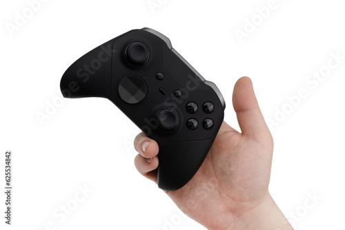 Joystick in hand on a white background. Gamepad in hand closeup isolated on white background.