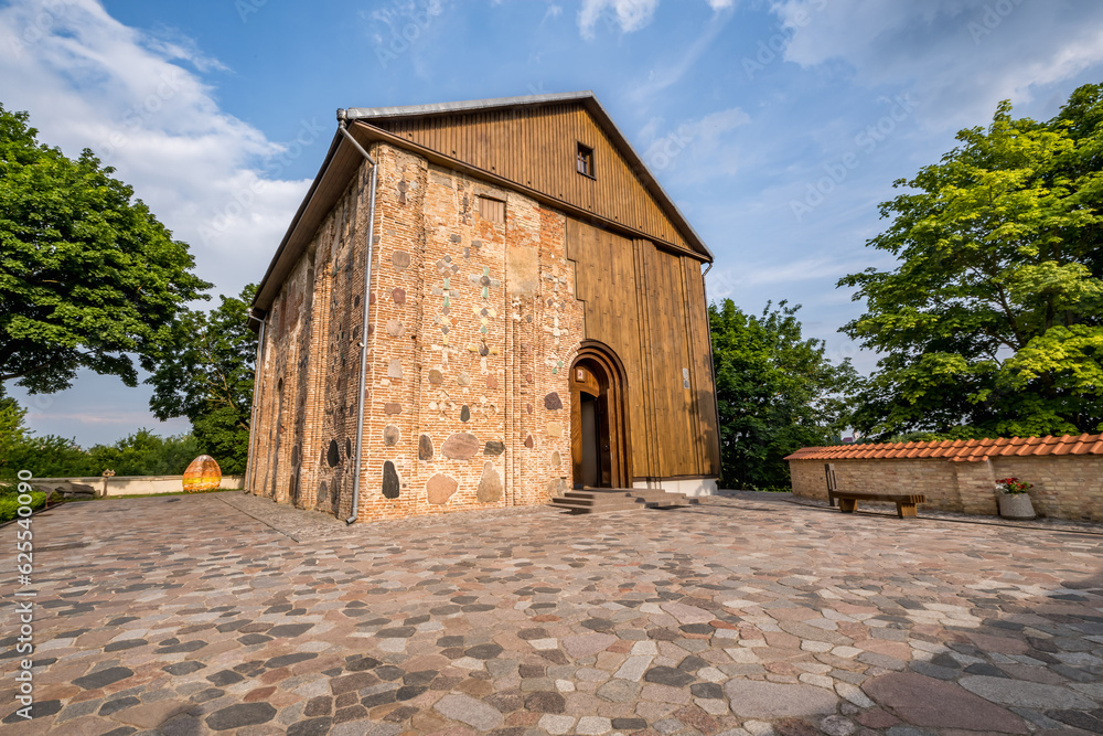 ancient orthodox church, monument of old brick russian architecture with texture of clay brick, decorated with inserts of colored stones in the shape of crosses. unesco monument