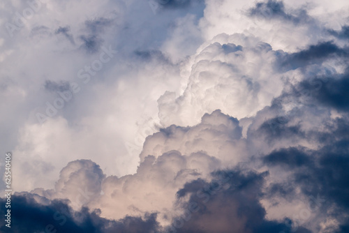 big white cumulus clouds on the blue sky