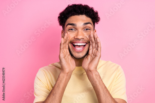 Close up photo of funny promoter guy pronouncing yelling novelty offer hands near mouth wear shirt isolated pink color background