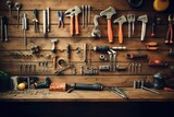 Various types of work tools placed on a wooden surface.