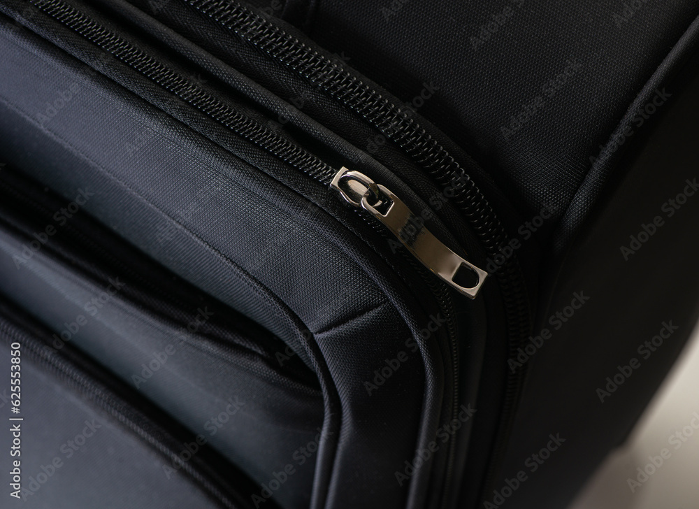 Close-up of black suitcase zipper