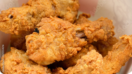 Crispy fried chicken drumsticks close up
