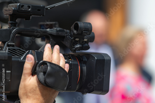 TV camera records a press conference, providing comprehensive media coverage and capturing important moments