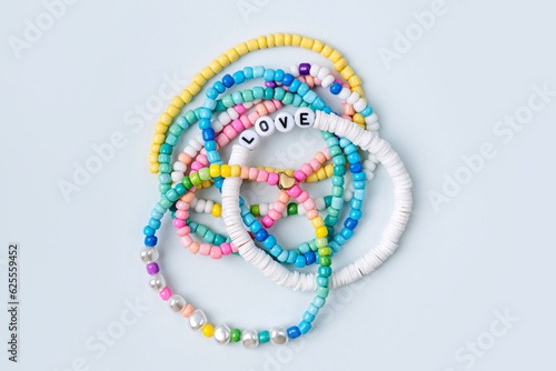 Wallpaper Mural Kids handmade beaded jewelry. Necklaces and bracelets made from multicolored beads and pearls. DIY bracelet beads. Children's needlework. Creativity and hobby. Art activity for kids Torontodigital.ca