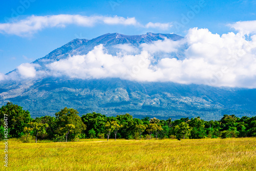 Savana Nusu In Amed, Bali. Bali Mountain with grass field photo