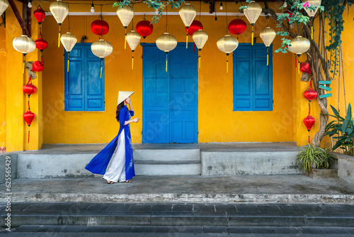 Konstfotografi Asian woman wearing vietnam culture traditional at Hoi an, Vietnam