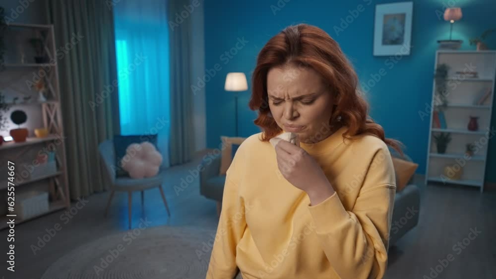 A woman with cold symptoms stands in the living room close up. The woman coughs, blows her nose with a paper handkerchief. A woman uses a nasal spray for a runny nose, takes a deep breath. A woman with cold symptoms stands in the living room close up. The woman coughs, blows her nose with a paper handkerchief. A woman uses a nasal spray for a runny nose, takes a deep breath.