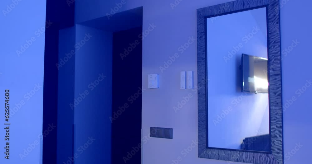 The man raises his head up in the night room. He turns and walks out the dark door. Mirror on the wall. Suspenders and a white shirt. End of the meeting. The man raises his head up in the night room. He turns and walks out the dark door. Mirror on the wall. Suspenders and a white shirt. End of the meeting.