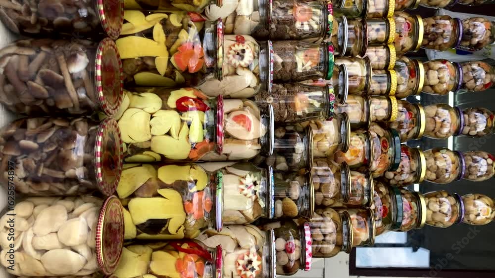 Jars with canned vegetables for the winter. Food. Keeping fresh fruits and vegetables. vertical video Jars with canned vegetables for the winter. Food. Keeping fresh fruits and vegetables. vertical video