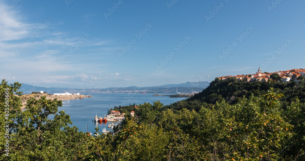 Omisalj village from lookout with dock and ships. Island Krk, Croatia