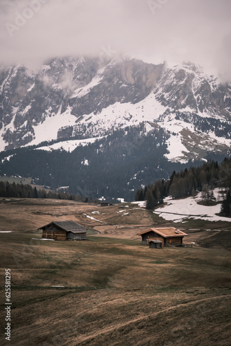  touristic houses. misty fog wooden travel cabin on the hills. Alpe di siusi, Seiser alm Italian.