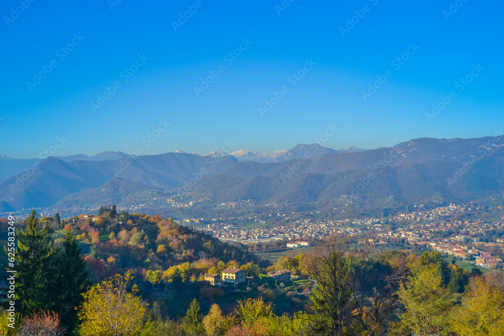Italy, Bergamo, 14.10.2017: View of the city of Bergamo from the hill on a sunny day at sunset