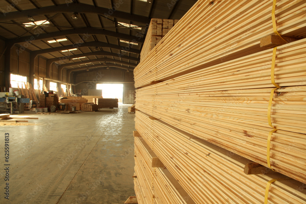 Wood timber construction material. Pile of construction timber at the construction site