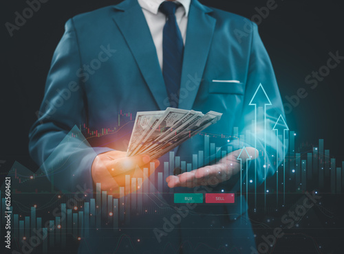 investment and finance concept, businessman holding money, stock market, profits and business growth