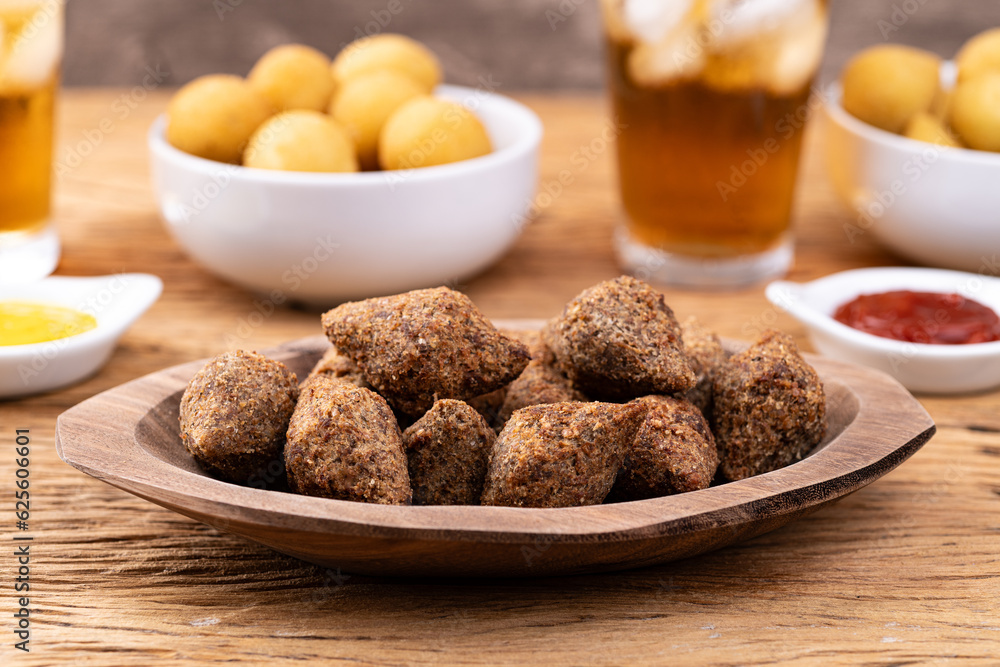 Traditional arabic fried tiny kibbeh. Typical brazilian snack Traditional arabic fried tiny kibbeh. Typical brazilian snack