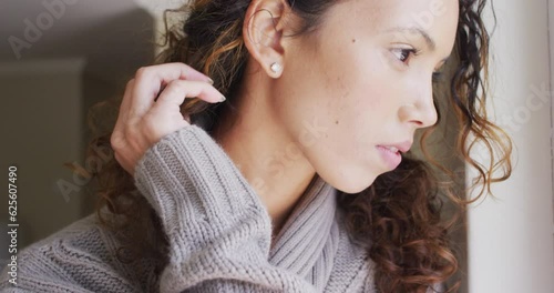 Wallpaper Mural Portrait of thoughtful biracial woman standing at window and looking into distance Torontodigital.ca
