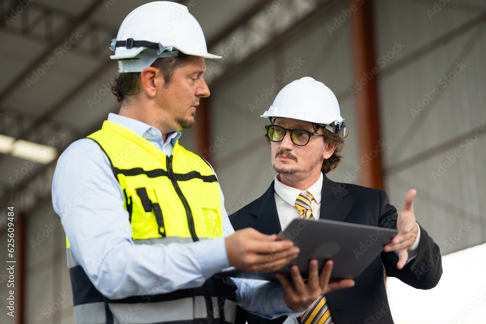 Caucasian construction architect Engineering man and busines owner in safety hardhat working at precast factory industrial. Heavy Industry Manufacturing Factory. Prefabricated concrete walls Caucasian construction architect Engineering man and busines owner in safety hardhat working at precast factory industrial. Heavy Industry Manufacturing Factory. Prefabricated concrete walls