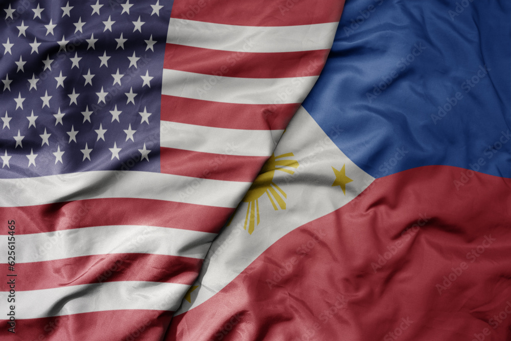 Obraz premium big waving colorful flag of united states of america and national flag of philippines .