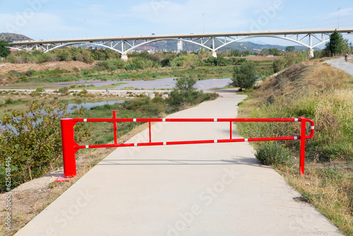 Red barrier to prevent the passage of vehicles.