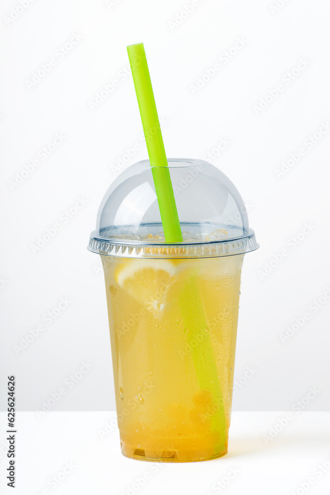 Beverage in a transparent plastic glass Beverage in a transparent plastic glass