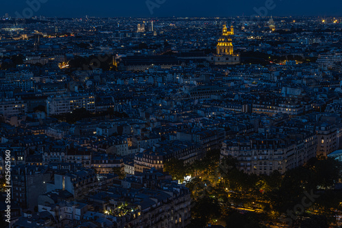 panoramic view of Parisian rooftops from Eifel Tower in the early evening