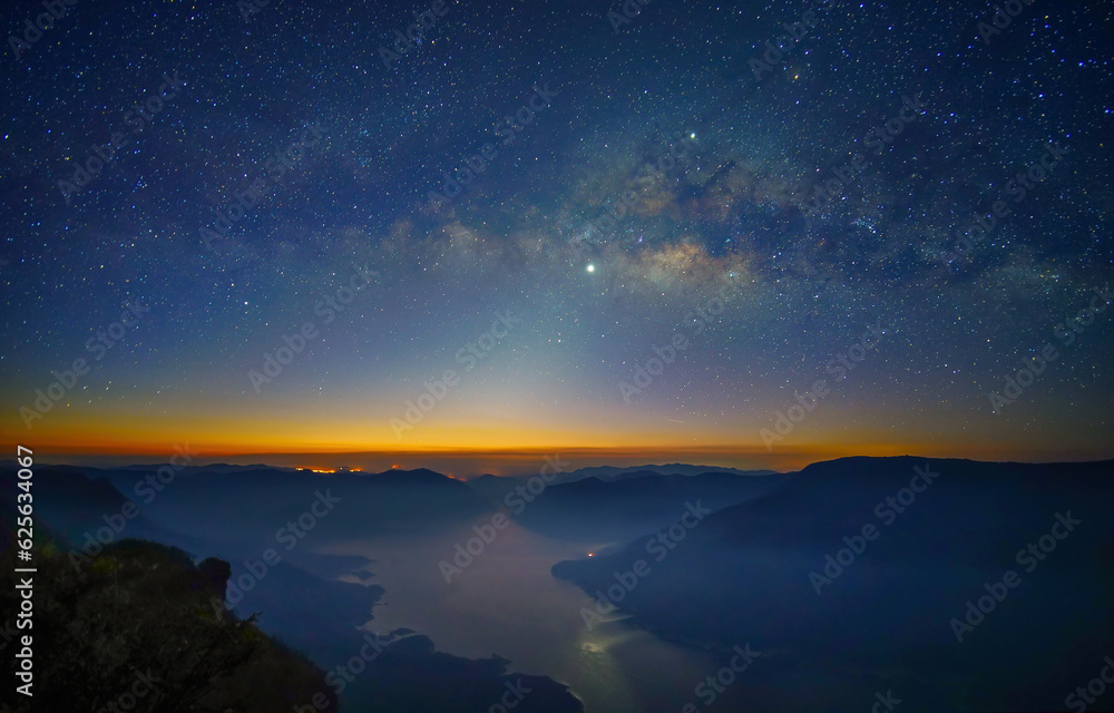Fototapeta premium Milky Way. Colorful night landscape with bright milky way, starry sky and hills in summer. Milky Way over the mountain peaks.