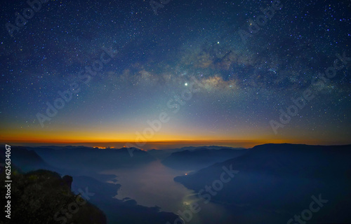 Milky Way. Colorful night landscape with bright milky way  starry sky and hills in summer. Milky Way over the mountain peaks.