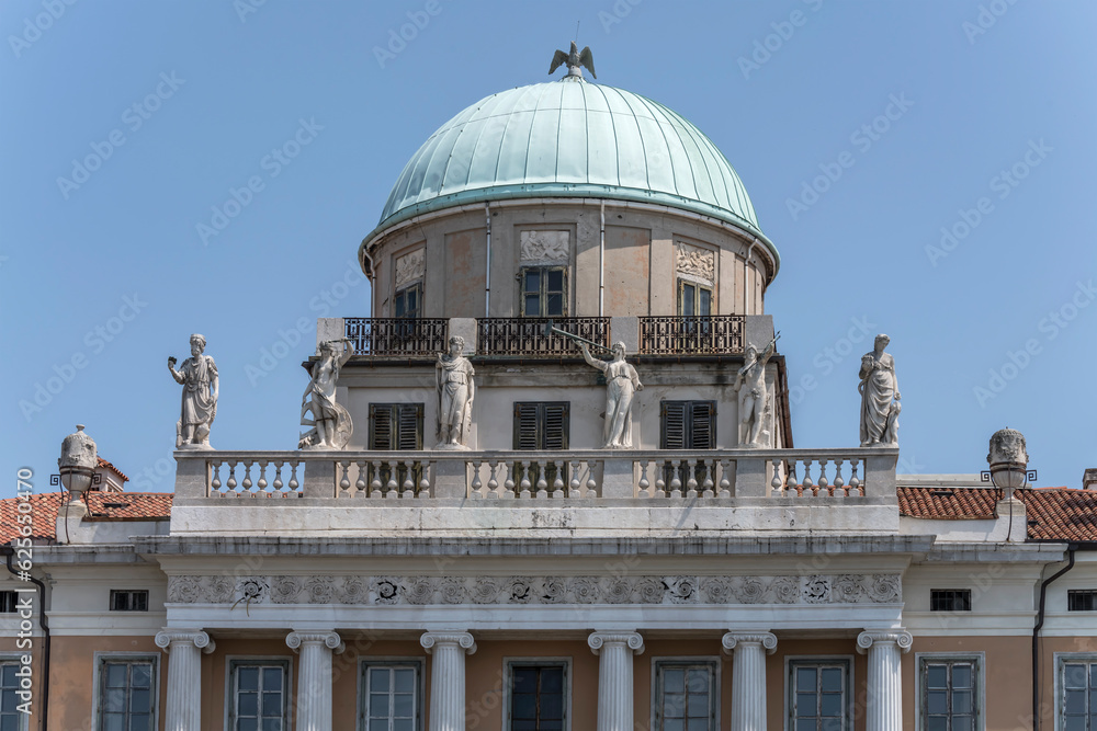 statues and dome on Carciotti building, Trieste, Friuli, Italy