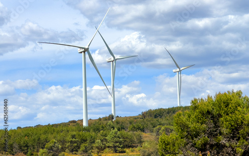 Wind turbine in mountains landscape. Eolic park windpower. Wind farm or New Wind green energy. Wind turbines alternative energy. Windmill power clean electricity generation in Valencia. Spain Windfarm © MaxSafaniuk