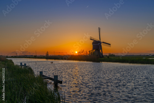 Sunset with windmill Broekmolen, Molenlanden - Nieuwpoort, The Netherlands