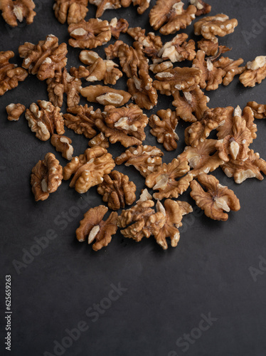 walnuts on black background, Healthy nuts background