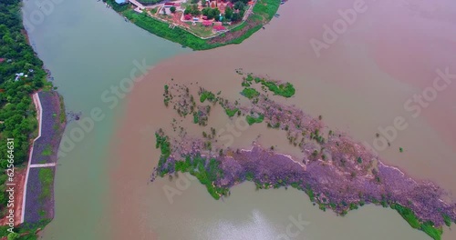 Aerial view amazing two colors in two rivers at three junctions in Khong Chiam Ubon Ratchathani Thailand..Mekong river the border between Thai and Lao..islands in the middle of Kong river background. photo