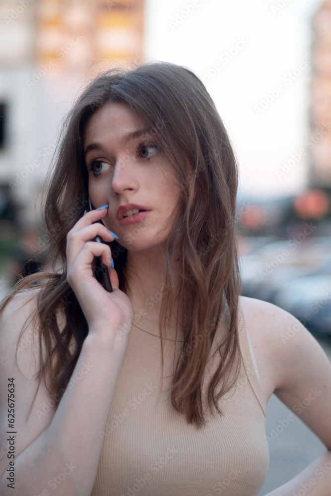woman talking on cell phone woman talking on cell phone