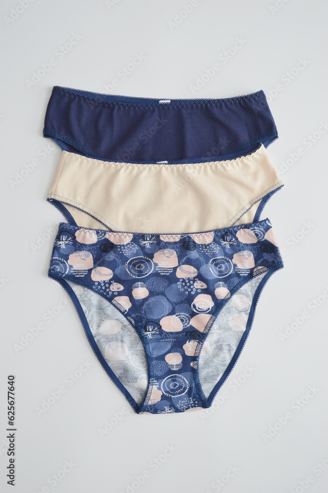 Lingerie. Set of women's colored cotton panties on a white background, top view. Women's underwear. Lingerie. Set of women's colored cotton panties on a white background, top view. Women's underwear.