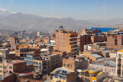 La Paz, the highest administrative capital and vibrant city in Bolivia viewed from the red cable car / teleferico from the center to El Alto market photo