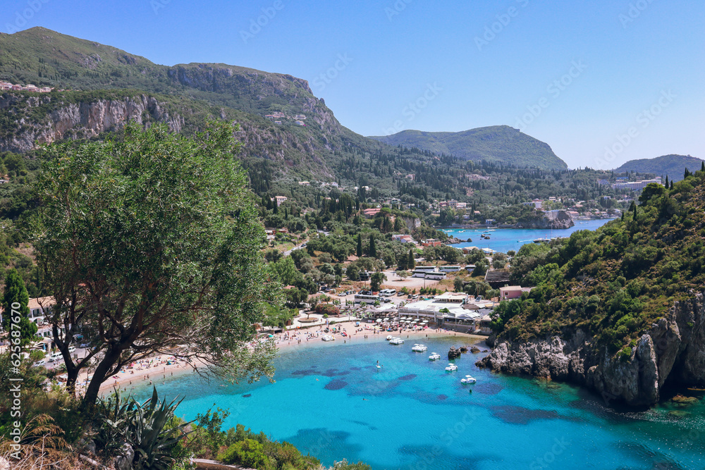 View of the sea and mountains of Paleokastritsa. The beach in the foreground is Agios Spiridon Beach, Corfu, Greece