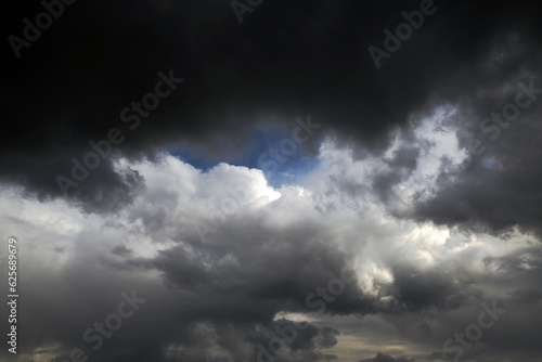 Eye of typhoon in the middle of thickening clouds. Impending typhoon, gathering hurricane, harbingers of storm and storm in the sky.