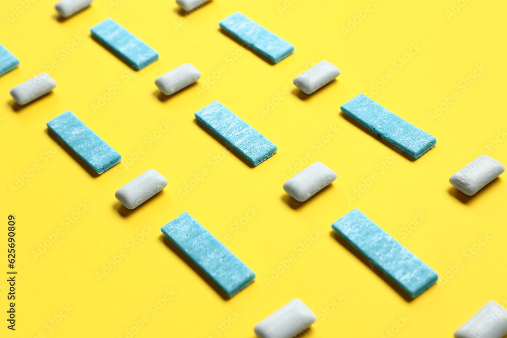Fresh chewing gums on yellow background Fresh chewing gums on yellow background