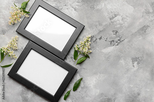 Two black photo frames with...