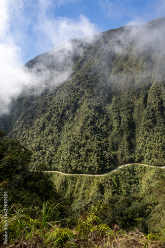 Driving the famous death road, the "Camino de la Muerte", in the Bolivian Andes near La Paz - traveling and exploring the Yungas