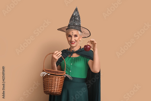 Mature witch with apple and...