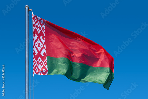 Flag of belarus close-up. The flag of Belarus fluttering in the wind against the blue sky. Flag of the Republic of Belarus close-up.