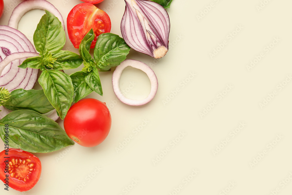 Fresh basil, cherry tomatoes and red onion on green background Fresh basil, cherry tomatoes and red onion on green background
