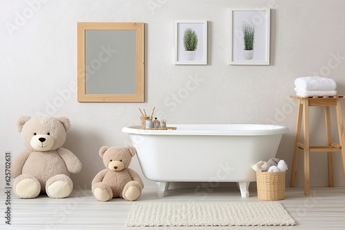 Toys for kids  a bear and a frame on a white wall  for design and layout. infant shower