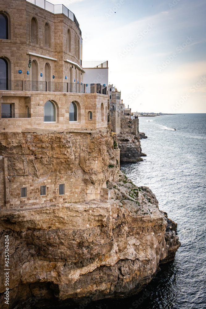 grottos, caves in polignano a mare, puglia, italy, europe, sunset, cliffs