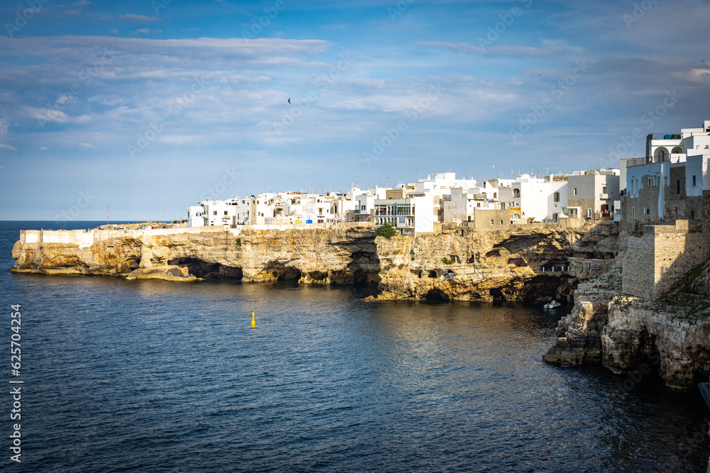 grottos, caves in polignano a mare, puglia, italy, europe, sunset, cliffs