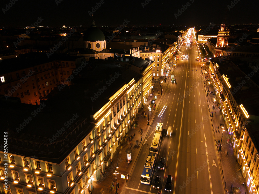 Aerial view of the bright Nevski street and Kazan Cathedral and House of the Singer company in the historical city of St. Petersburg at light night 